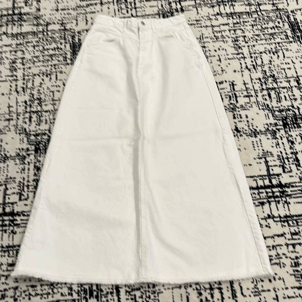 Free People denim maxi skirt . Preowned. Size 4. White . Preowned.